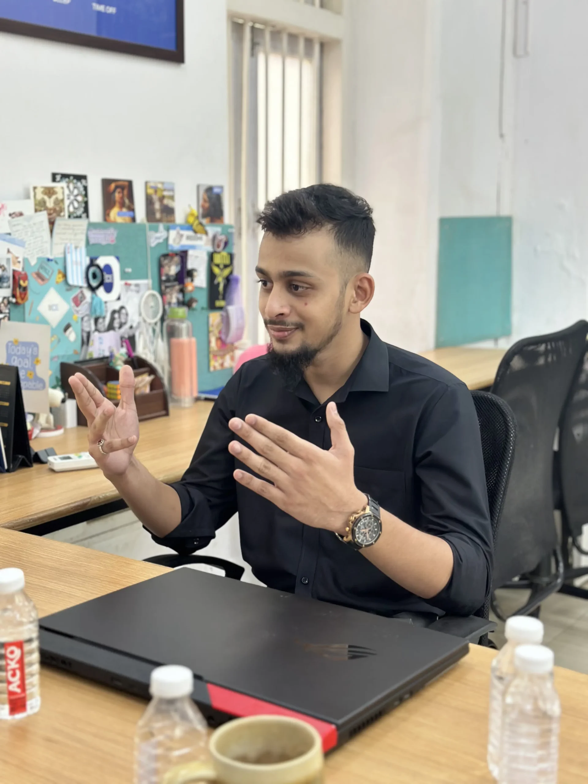 Hussain Itarsiwala, digital marketing consultant, explaining campaign strategy at his desk in Mumbai
